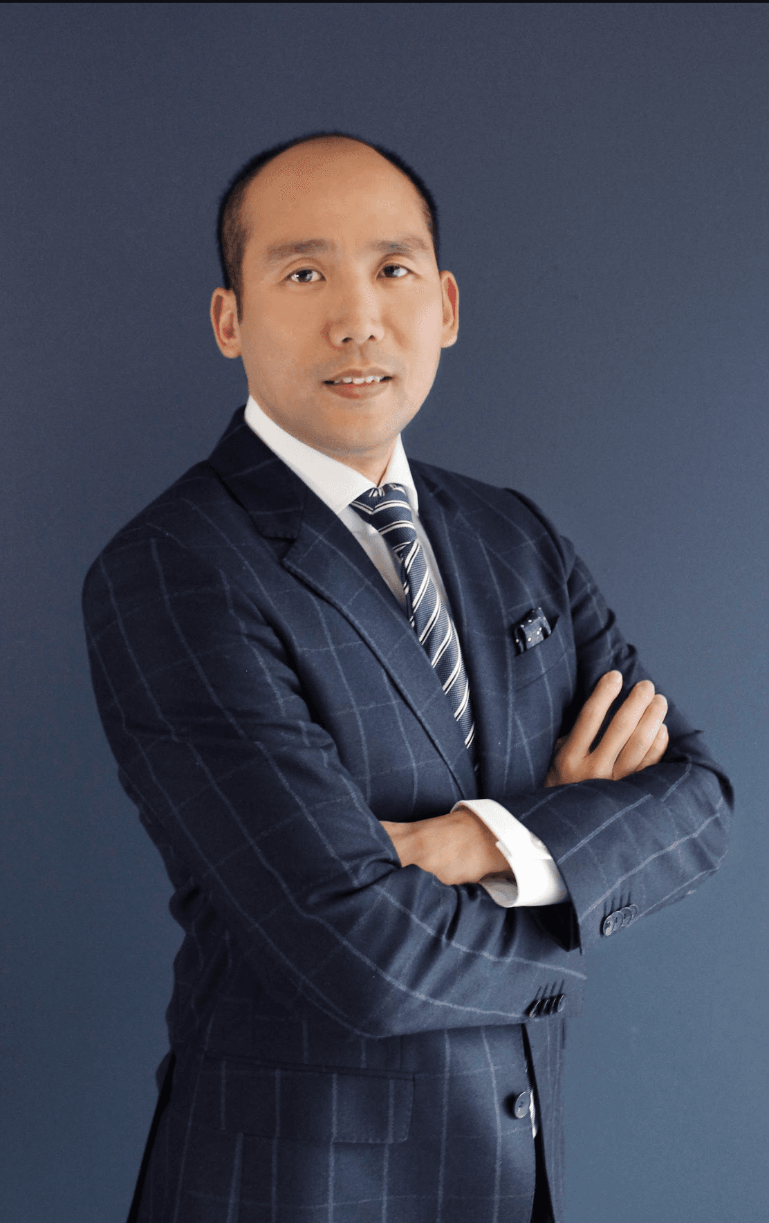 Nicolas Zhao in a navy suit